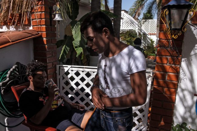 One of the LGBT+ asylum seekers rest at the rented accommodation in Tijuana.