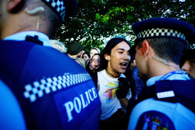 Protesters make a stand for their rights as the New Zealand police arrive at the Auckland Pride Party on February 20, 2016 in Auckland, New Zealand.