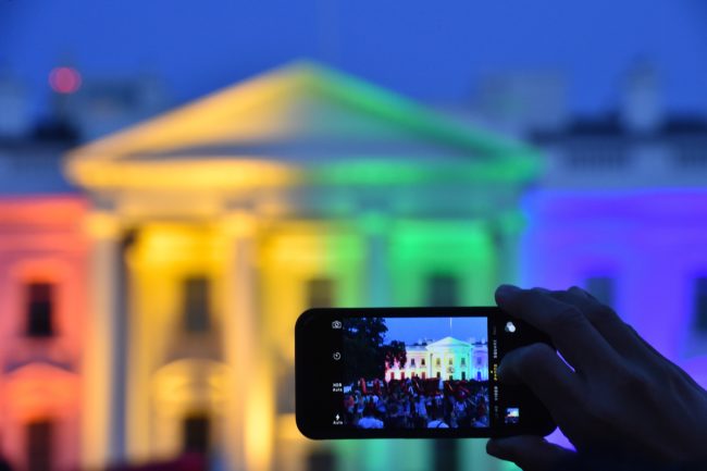 A person outside the White House, as equal marriage supporters celebrate
