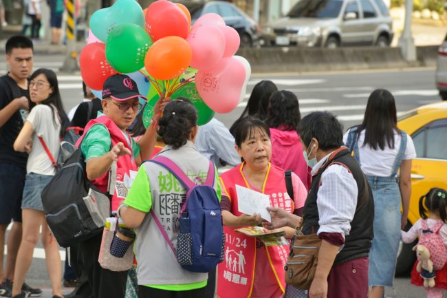 Anti-gay marriage campaigners hand out leaflets in Taipei