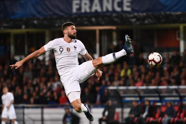 Chelsea forward Olivier Giroud jumps for the ball during the friendly football match between France and Iceland