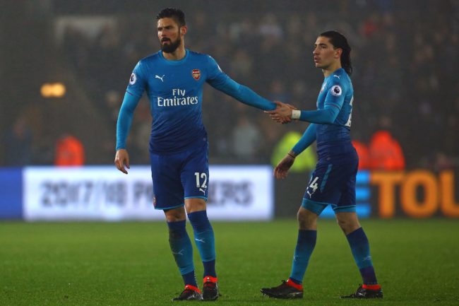 Chelsea striker Olivier Giroud while he was at Arsenal, shaking hands with then-teammate, Spanish defender Hector Bellerin