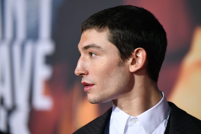 Ezra Miller poses as he arrives for the world premiere of Warner Bros. Pictures film Justice League