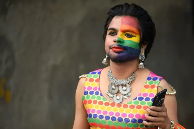 Gay India pride: One of the thousands of people wearing rainbow-coloured outfits who rallied in the Indian capital territory on November 25