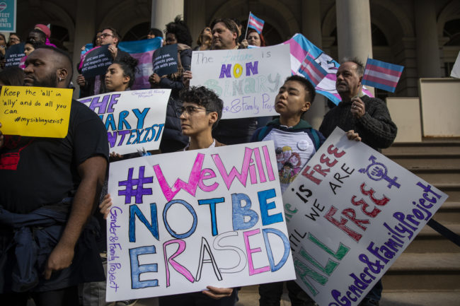 LGBT activists rally in support of transgender people on the steps of New York City Hall