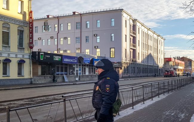 Russian police patrol a street near a building housing the FSB security service in Arkhangelsk on October 31, 2018.