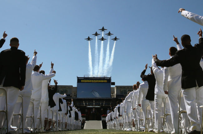 The Blue Angels fly over U.S. Naval Academy graduation ceremonies, although cadets who are diagnosed as HIV-positive will not have a chance to commission under longstanding military HIV ban.