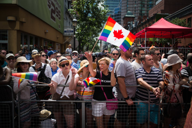 Spectators attend the annual Pride Festival parade in Toronto, Canada, where the new $1 coin will be released in 2019.