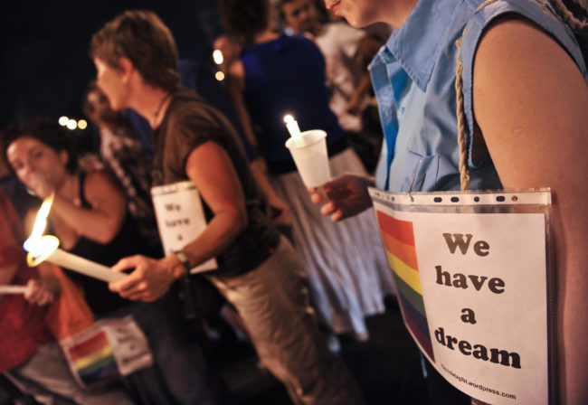 Italian gay rights supporters take part in a ceremony to protest against increasing instances of homophobia, one of the issue the survey condemned for "promoting sexual fluidity" was meant to address.