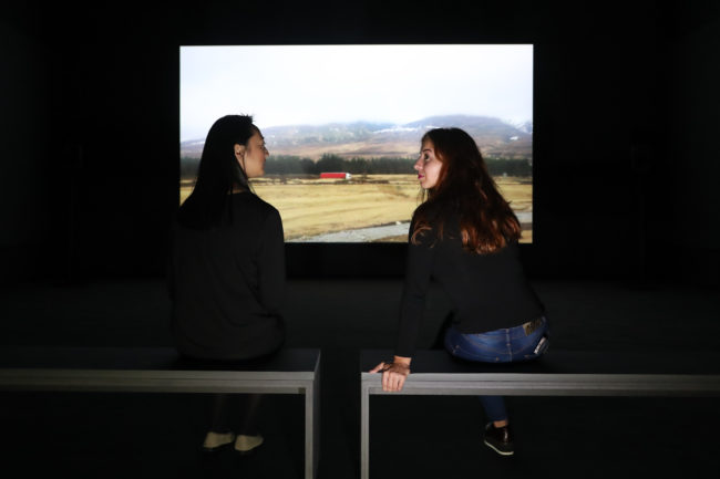 People watching Bridgit, a film by Charlotte Prodger, at Tate Britain in London