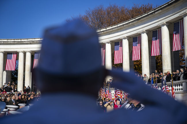 A veteran salutes as the Honor Guard arrives during a Veterans Day ceremony at Arlington National Cemetery, on November 11, 2018 in Arlington, Virginia. 