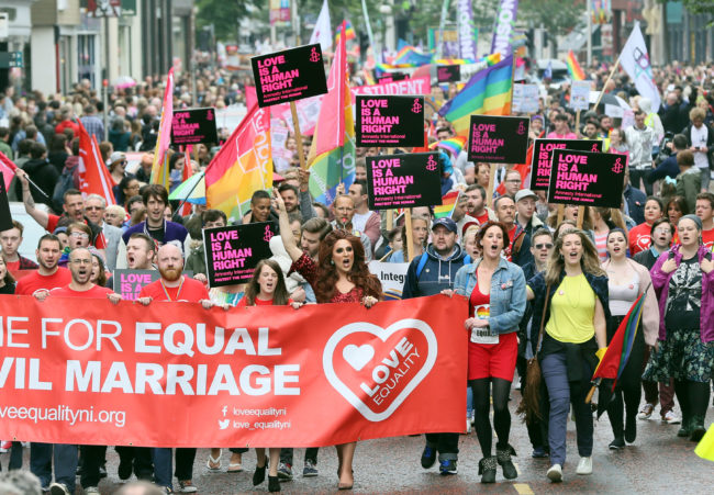 Gay rights campaigners take part in a march through Belfast on July 1, 2017 to protest against the ban on same-sex marriage.