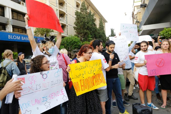 Activists from of the Lebanese LGBT community take part in a protest outside the Hbeish police station in Beirut on May 15, 2016, calling for the abolition of article 534 of the Lebanese Penal code