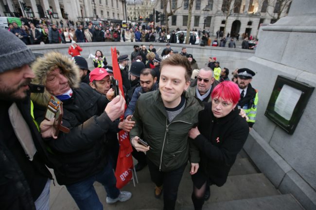 Guardian journalist Owen Jones is confronted by protesters in central London