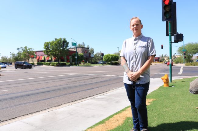 An ACLU picture of Meagan Hunter standing on the pavement across from Chili's