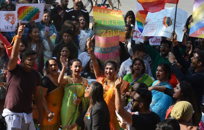 Activists and members of the lesbian, gay, bisexual, and transgender (LGBT) community in India take part in a pride parade in Siliguri on December 30 2018