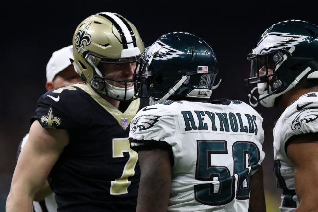 Taysom Hill of the New Orleans Saints argues with LaRoy Reynolds of the Philadelphia Eagles during the NFC Divisional Playoff