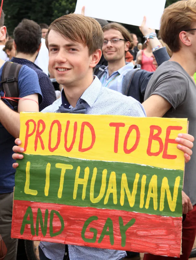 In Vilnius, Lithuania, a man holds a placard reading "Proud To be Lithuanian and Gay " while taking part in the ''Baltic Pride 2013'' march on July 27, 2013