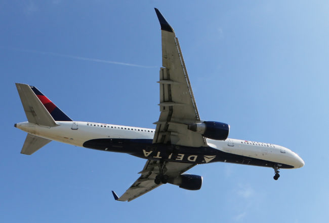 A Delta Airlines plane like the one the queer deaf couple was booked on lands at Los Angeles International Airport on July 12, 2018 in Los Angeles, California