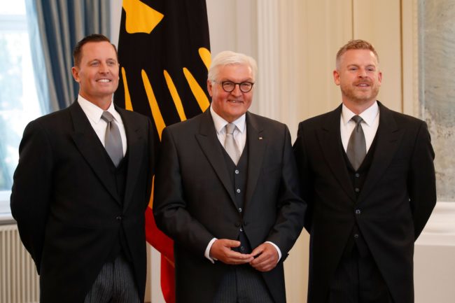 Newly accredited US Ambassador Richard Allen Grenell (L), his partner Matt Lashey (R) and German President Frank-Walter Steinmeier pose for photographers during an accreditation ceremony for new Ambassadors in Berlin, Germany, on May 08, 2018. 