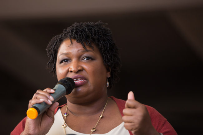 Democratic Georgia Gubernatorial candidate Stacey Abrams talks to a crowd gathered for the "Souls to The Polls" march in downtown Atlanta on October 28, 2018 in Atlanta, Georgia.