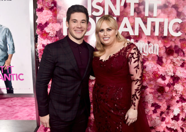 Adam Devine and Rebel Wilson attend the premiere of Warner Bros. Pictures' "Isn't It Romantic" at The Theatre at Ace Hotel on February 11, 2019 in Los Angeles, California.