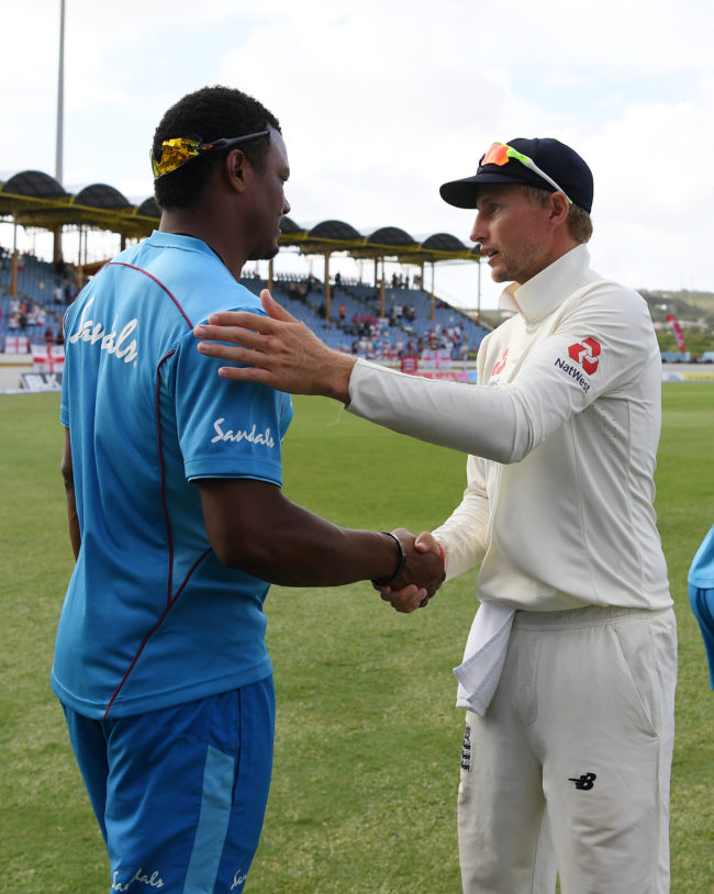 Shannon Gabriel of the West Indies with Joe Root of England following England's victory during Day Four of the Third Test match between the West Indies and England at Darren Sammy Cricket Ground on February 12, 2019 in Gros Islet, Saint Lucia
