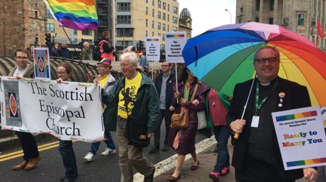 Reverend Kelvin Holdsworth (right) at a gay rights march in Scotland