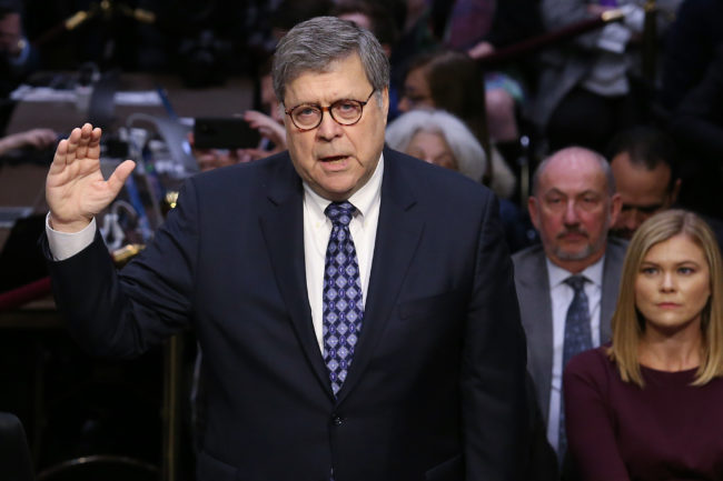 US Attorney General nominee William Barr (C) is sworn in prior to Barr testifying at his confirmation hearing January 15, 2019 in Washington, DC. Barr, who previously served as Attorney General under President George H. W. Bush, was confronted about his views on the investigation being conducted by special counsel Robert Mueller.