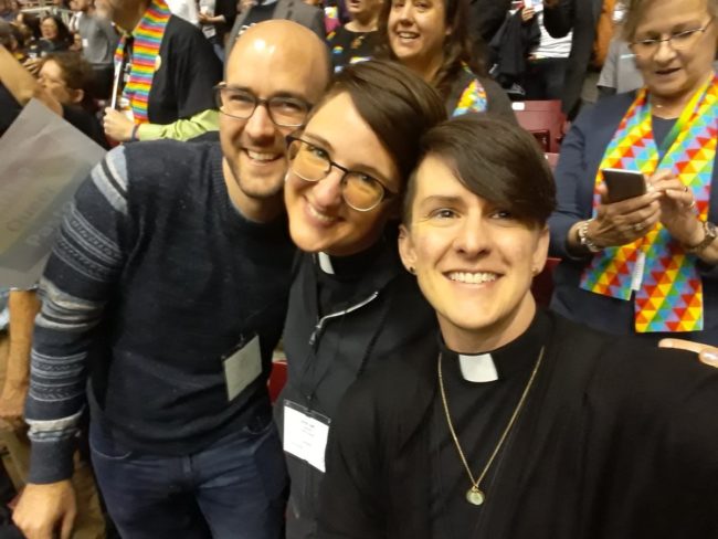 Delegates smile at the camera during the worldwide United Methodist General Conference in St. Louis, Missouri in 2019