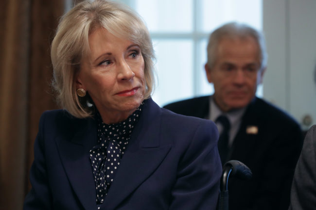 Education Secretary Betsy DeVos listens to U.S. President Donald Trump talk to reporters during a cabinet meeting in the Cabinet Room at the White House February 12, 2019 in Washington, DC.