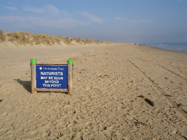  Gay nude beaches: Naturist sign on nudist beach in Bournemouth 