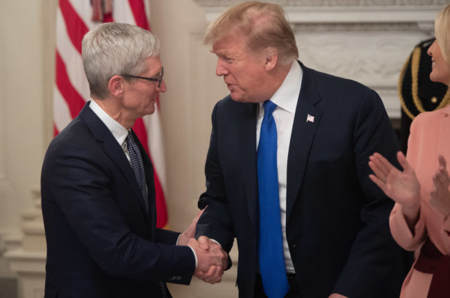US President Donald Trump shakes hands with Apple CEO Tim Cook after calling him "Tim Apple" during the first meeting of the American Workforce Policy Advisory Board in the State Dining Room of the White House in Washington, DC, March 6, 2019.