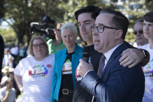 Gay Qantas CEO Alan Joyce and his partner Shane Lloyd after the 'Yes' announcement at Prince Alfred Park on November 15, 2017 in Sydney, Australia.