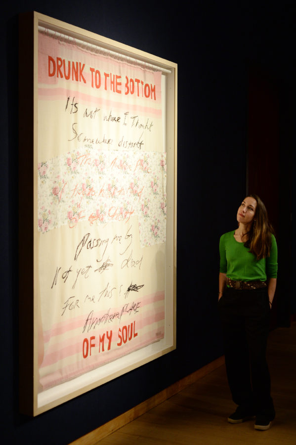 Staff member poses with work titled ‘Drunk to the Bottom of my Soul’ by Tracey Emin as Christie's presents an exhibition of works from it's George Michael Collection Highlights at Christie's on March 08, 2019 in London, England. 