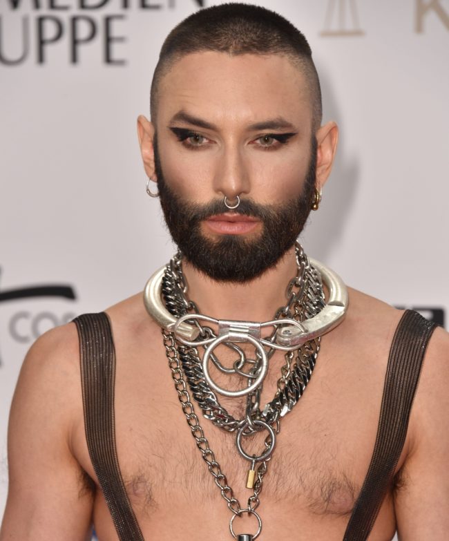 Austrian drag singer Conchita Wurst poses on the red carpet as he arrives at the Golden Camera awards ceremony in Berlin on March 30, 2019. 