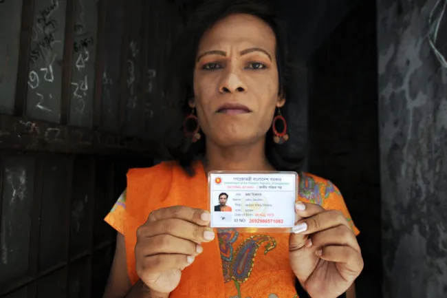 Bangladeshi hijra social worker Joya Shikder holds her national identity card.