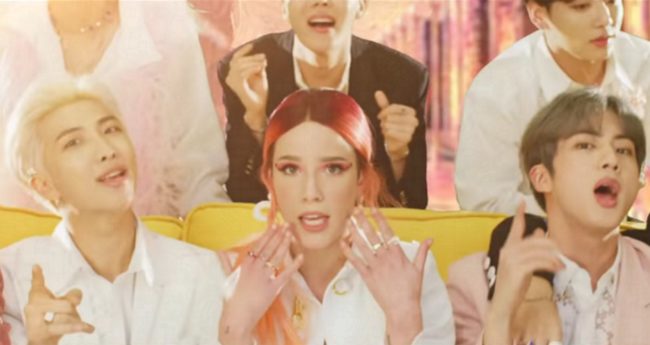 Halsey looks to camera during the music video for "Boys With Luv" with BTS.