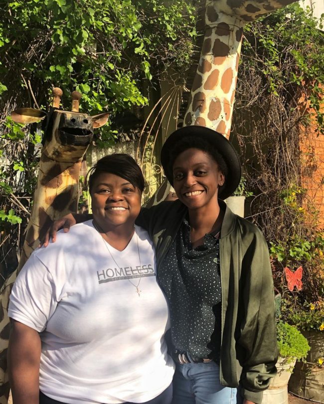 Queer Eye stars Jess Guilbeaux and Mama Tammye smiling at the camera.