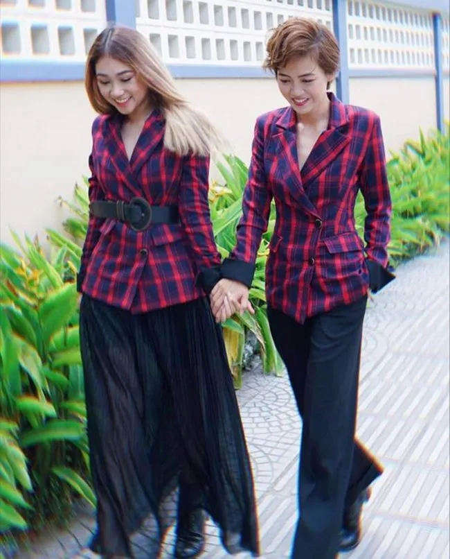 The Bachelor couple Minh Thu and Truc Nhu walk through the streets of Vietnam.