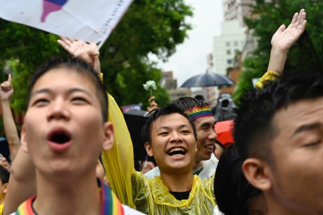 Gay rights supporters celebrate outside Parliament after lawmakers legalised same-sex marriage bill in Taipei on May 17, 2019. 