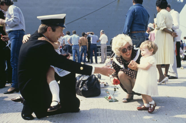 Sailor greeting child after returning from Falklands War