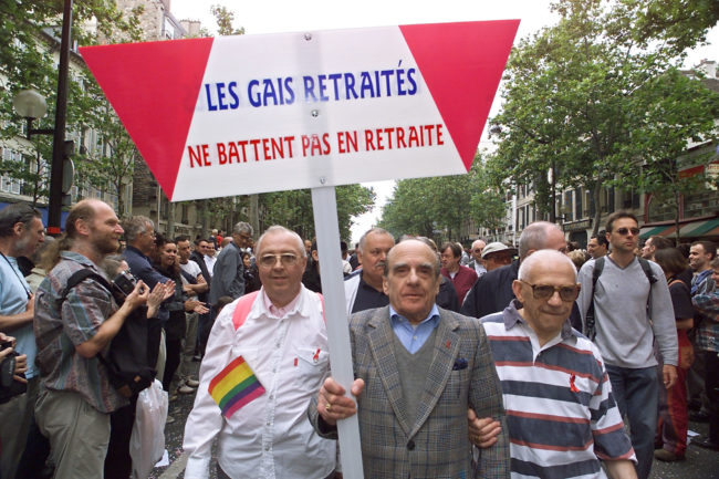 Older LGBT people demonstrate, 24 June 2000 in Paris, during the 2000 Gay Pride, holding a sign reading "Gay retired don't retire".
