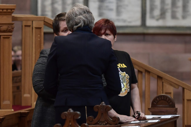 British Prime Minister Theresa May speaks with Sara Canning the funeral service of journalist Lyra McKee at St Anne’s Cathedral on April 24, 2019 in Belfast, Northern Ireland.