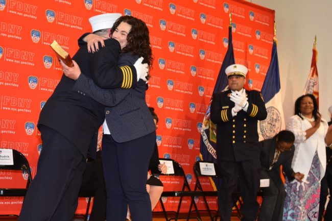Lillian Bonsignore hugs her wife Kim after being sworn in as the FDNY's EMS chief. 